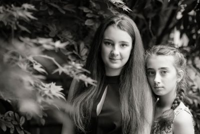 a seriously beautiful black and white portrait of sisters in the outdoor studio